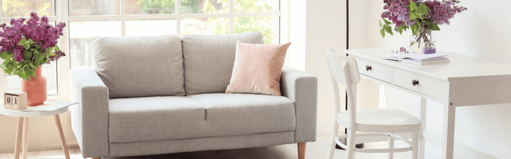 Woman creating a cozy and inviting environment in her home that brings her joy after her divorce. 